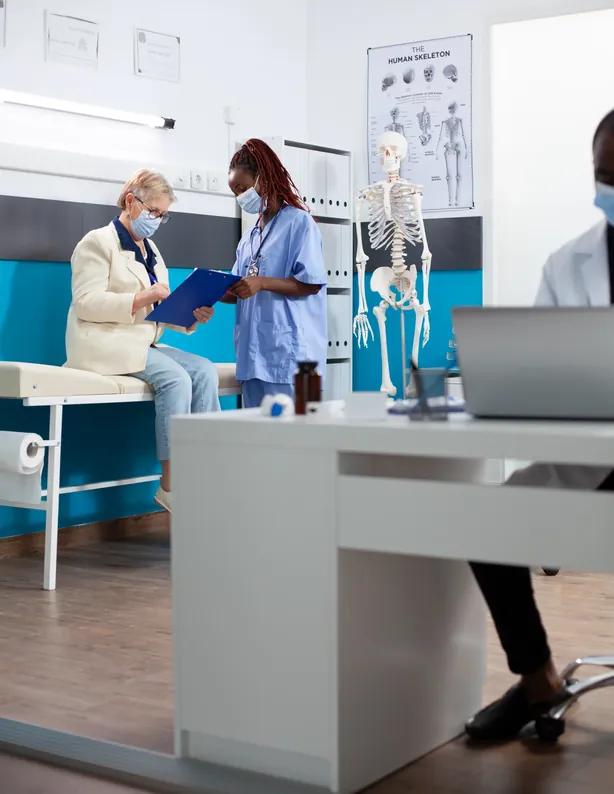 A nurse guiding a patient at a check-up