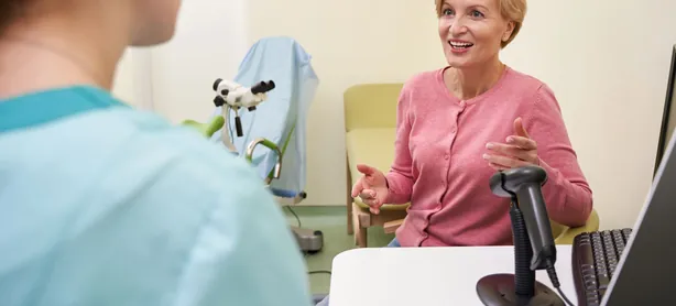 A cheerful woman visiting her doctor
