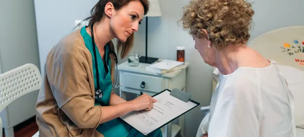 A doctor filling out a questionnaire