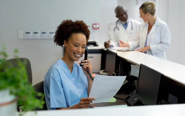 A doctor at the reception desk